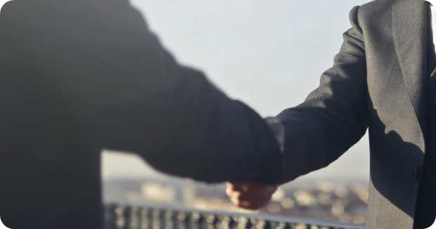 professional handshake representing trusted financial and tax advisory partnerships